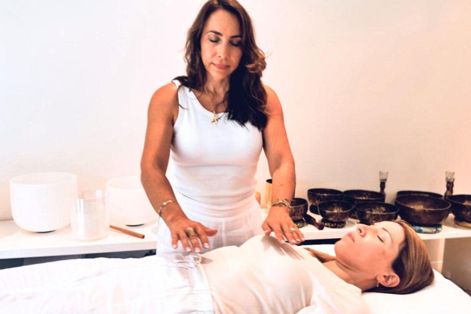 Jen Laws Sound Healing session with client, using crystal bowls, Tibetan bowls, energy healing and much more