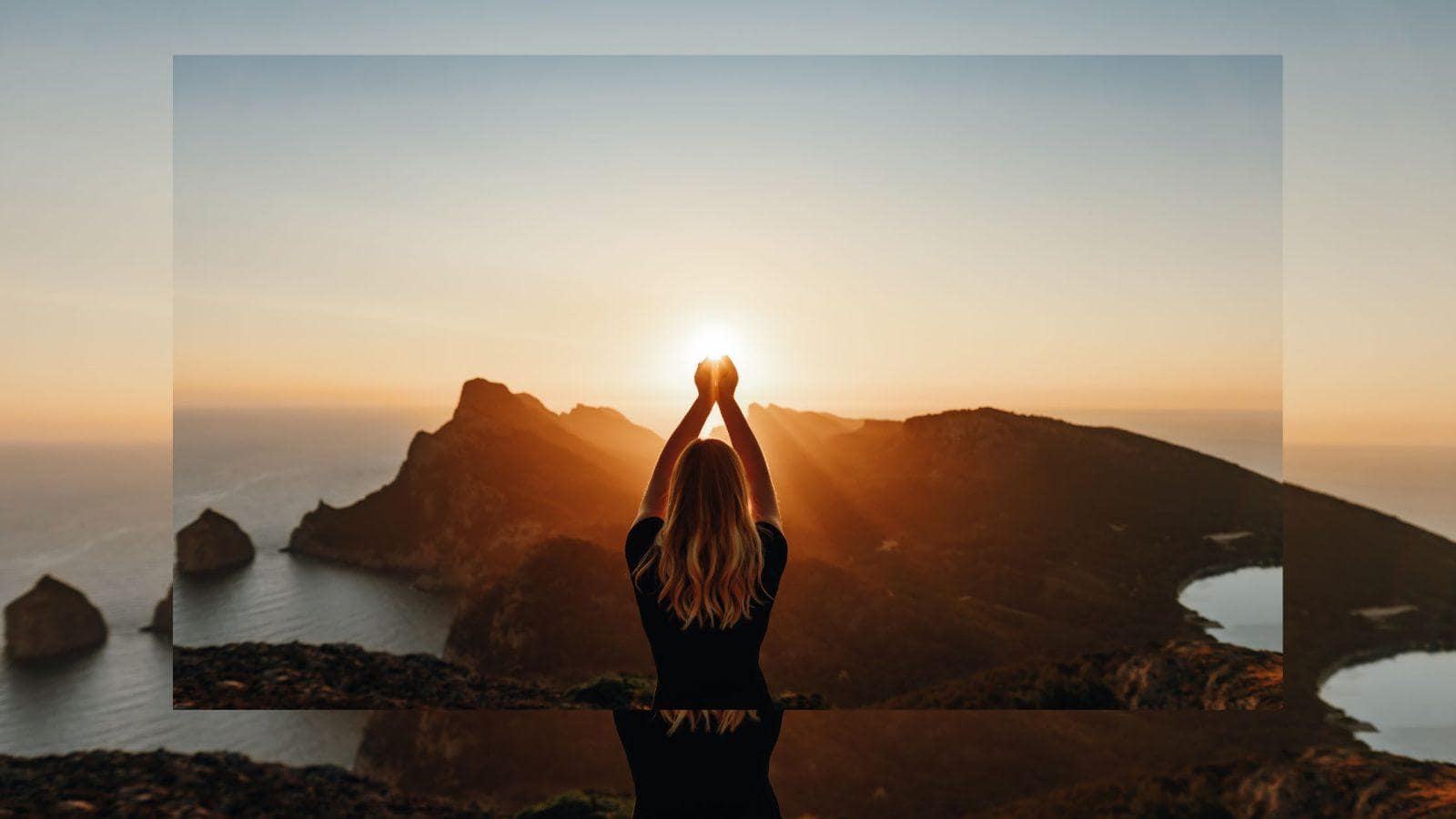 image of a soulful midlife woman seeing the light into her boundaries for midlife, featuring a confident woman at sunrise transitioning from a shadowed interior to a peaceful, light-filled landscape.